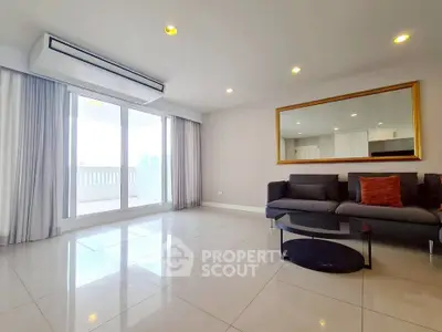 Spacious modern living room with large windows and elegant decor