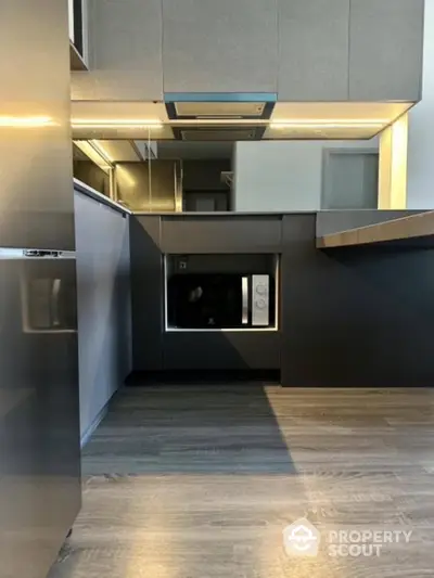 Modern kitchen with sleek cabinetry and built-in appliances