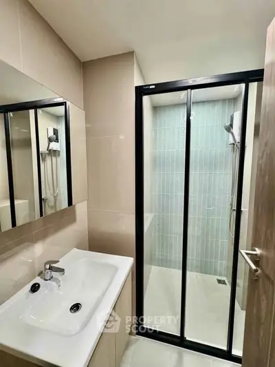 Modern bathroom with sleek shower enclosure and stylish vanity unit