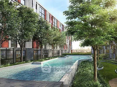 Modern residential building with a sleek swimming pool and lush greenery, offering a serene urban oasis.