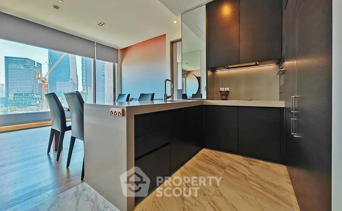 Luxurious modern kitchen with open layout and stunning city view