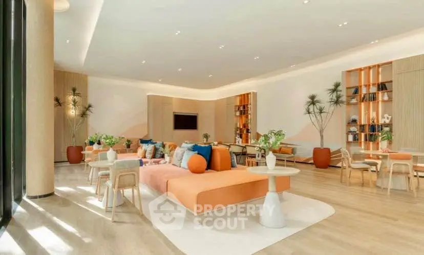 Spacious modern living room with stylish decor and ample natural light