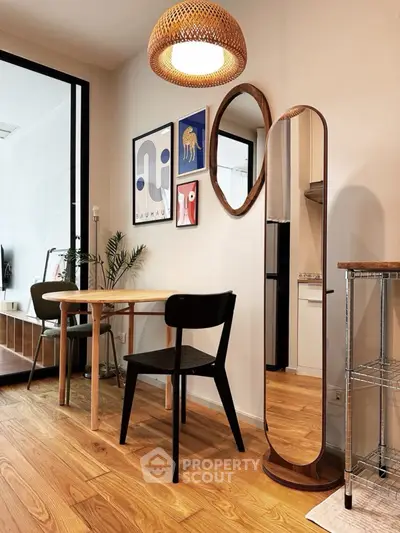 Chic modern dining area with stylish decor and wooden flooring, perfect for urban living.
