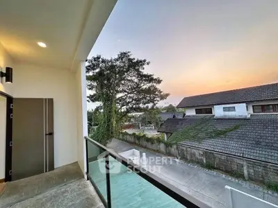 Stunning balcony view with serene neighborhood and sunset backdrop