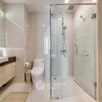 Modern bathroom with glass shower and sleek fixtures