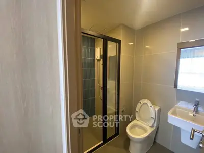 Modern bathroom with glass shower and sleek fixtures
