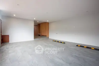 Spacious modern parking area with sleek design and ample lighting