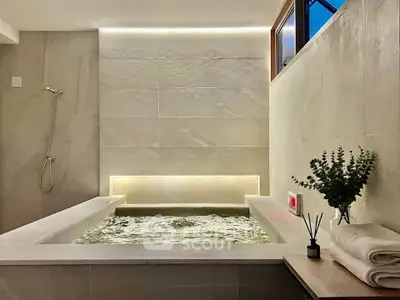 Luxurious bathroom with modern bathtub and ambient lighting