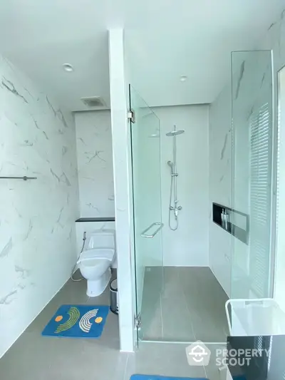 Modern bathroom with glass shower enclosure and sleek design