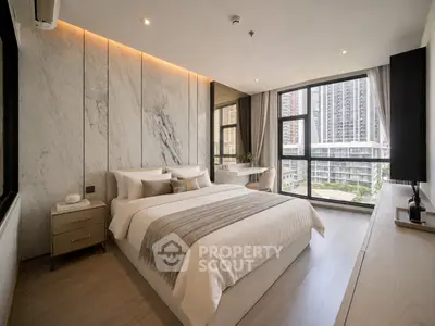 Luxurious modern bedroom with city view, elegant decor, and natural light.