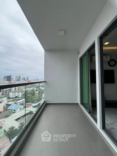 Spacious balcony with city view in modern apartment
