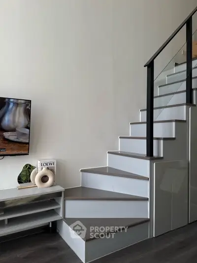Modern interior with sleek staircase and stylish decor in a contemporary living space.