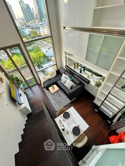 Stunning loft apartment with high ceilings and city view, featuring modern living area and dining space.