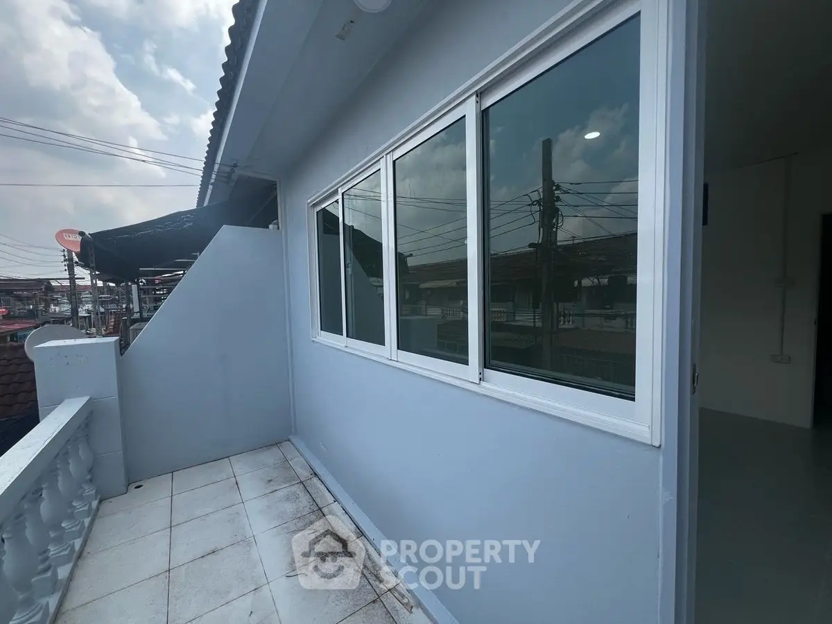 Charming balcony with city views, perfect for relaxing and enjoying the urban landscape.