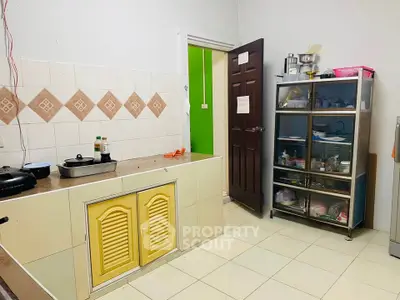 Cozy kitchen with closed layout and ample storage space