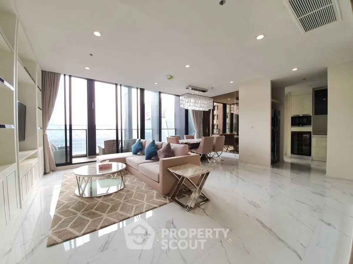 Luxurious open-plan living room with elegant decor and stunning city view