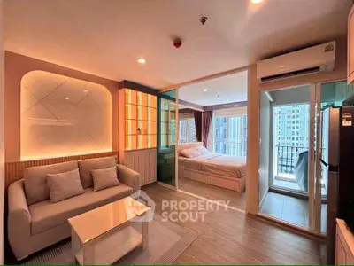 Modern open-plan living room with cozy sofa and stylish bedroom view