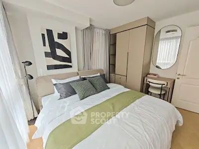 Cozy bedroom with modern decor, featuring a stylish bed, sleek wardrobe, and elegant lighting.