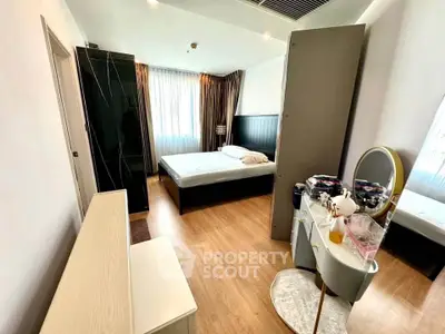 Spacious bedroom with modern decor and natural light