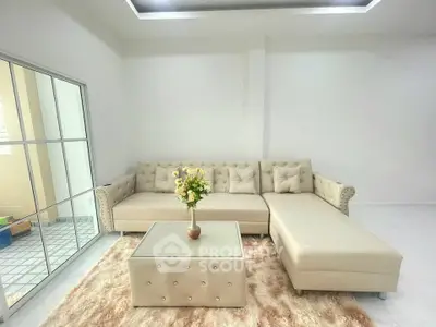 Elegant living room with plush sectional sofa and chic coffee table