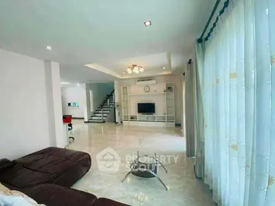 Spacious modern living room with elegant decor and natural light