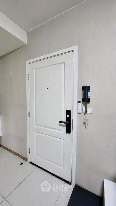 Modern apartment entrance with secure door and intercom system