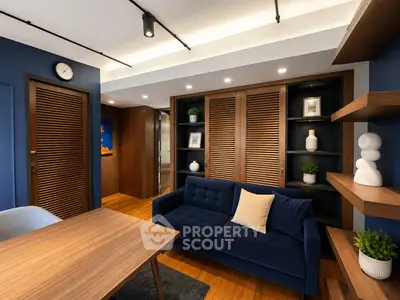 Modern living room with blue sofa, wooden accents, and stylish decor in a cozy apartment.