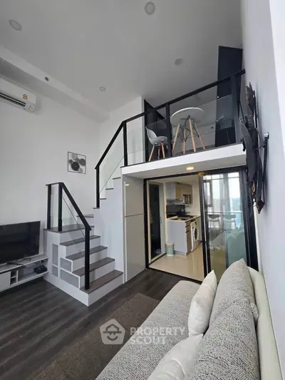 Modern loft apartment with mezzanine, stylish staircase, and open living area, perfect for urban living.