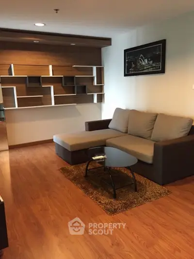 Modern living room with stylish sectional sofa and unique wall shelving