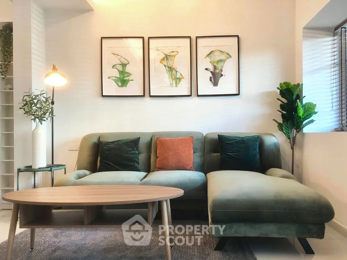 Stylish living room with modern green sofa and elegant decor, perfect for contemporary homes.