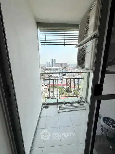 Modern balcony with panoramic city view and sleek design elements.