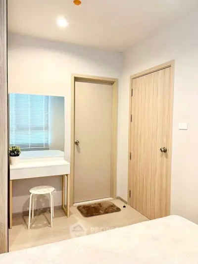 Cozy bedroom with minimalist decor and vanity area