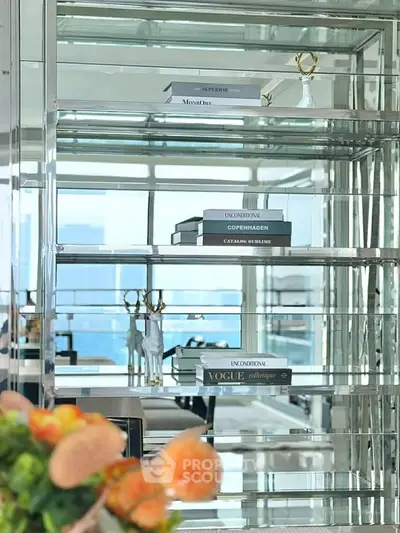 Luxurious modern interior with mirrored shelves and stylish decor in a high-rise apartment.