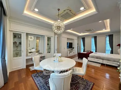 Luxurious open-plan living room with elegant dining area and modern decor