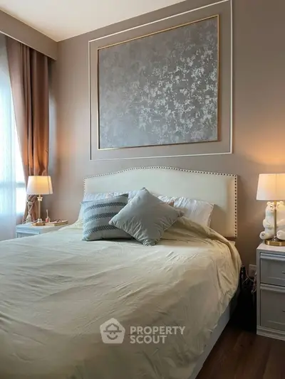Elegant bedroom with stylish decor and soft lighting, featuring a comfortable bed and modern furnishings.