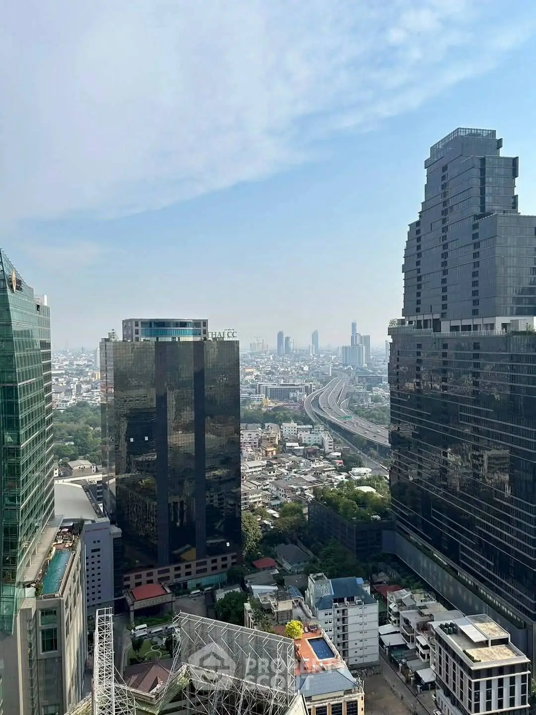 Stunning cityscape view from high-rise building showcasing urban skyline and architecture.