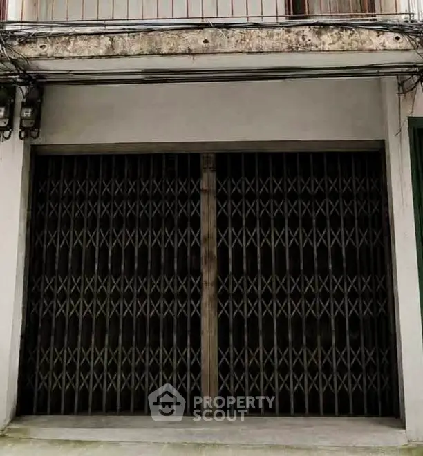 Secure garage entrance with metal gate in urban building