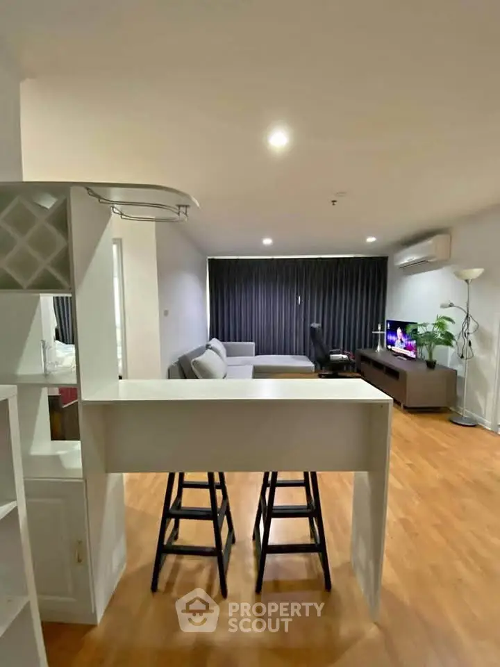 Spacious modern living room with stylish furniture and open layout, perfect for relaxation and entertainment.