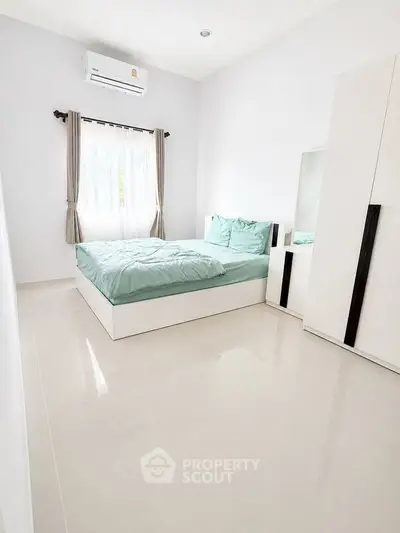 Bright and airy bedroom with modern furnishings and natural light