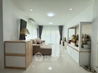Spacious modern living room with elegant decor and ample natural light
