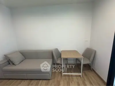 Cozy minimalist living room with modern sofa and dining table