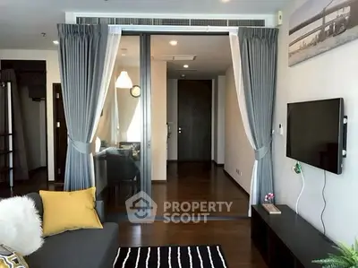 Modern living room with stylish decor and wall-mounted TV