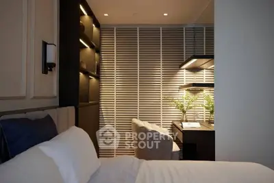 Luxurious bedroom with modern study area, featuring elegant lighting and stylish decor.