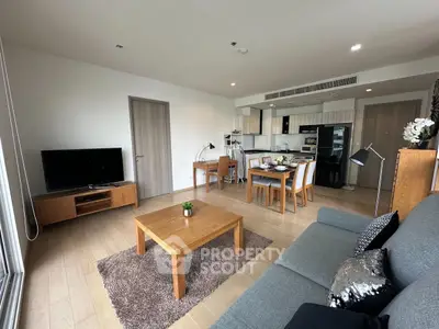 Spacious modern living room with open kitchen and stylish decor