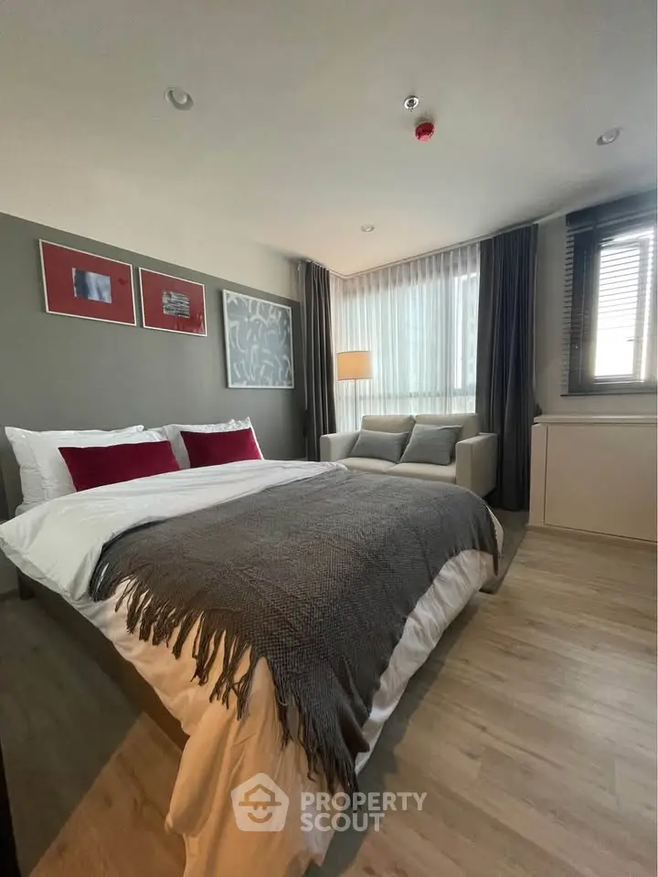 Modern bedroom with cozy decor and natural light