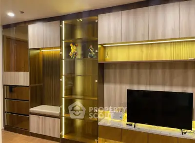 Modern living room with stylish wooden cabinetry and built-in TV unit
