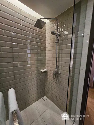 Modern bathroom shower with sleek tile design and rainfall showerhead