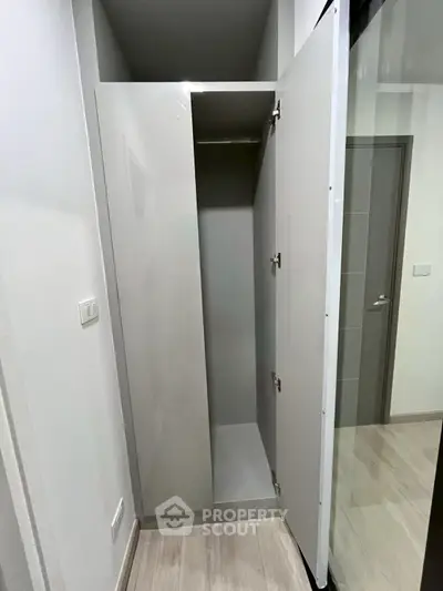 Modern interior storage space with sleek white cabinetry and minimalist design