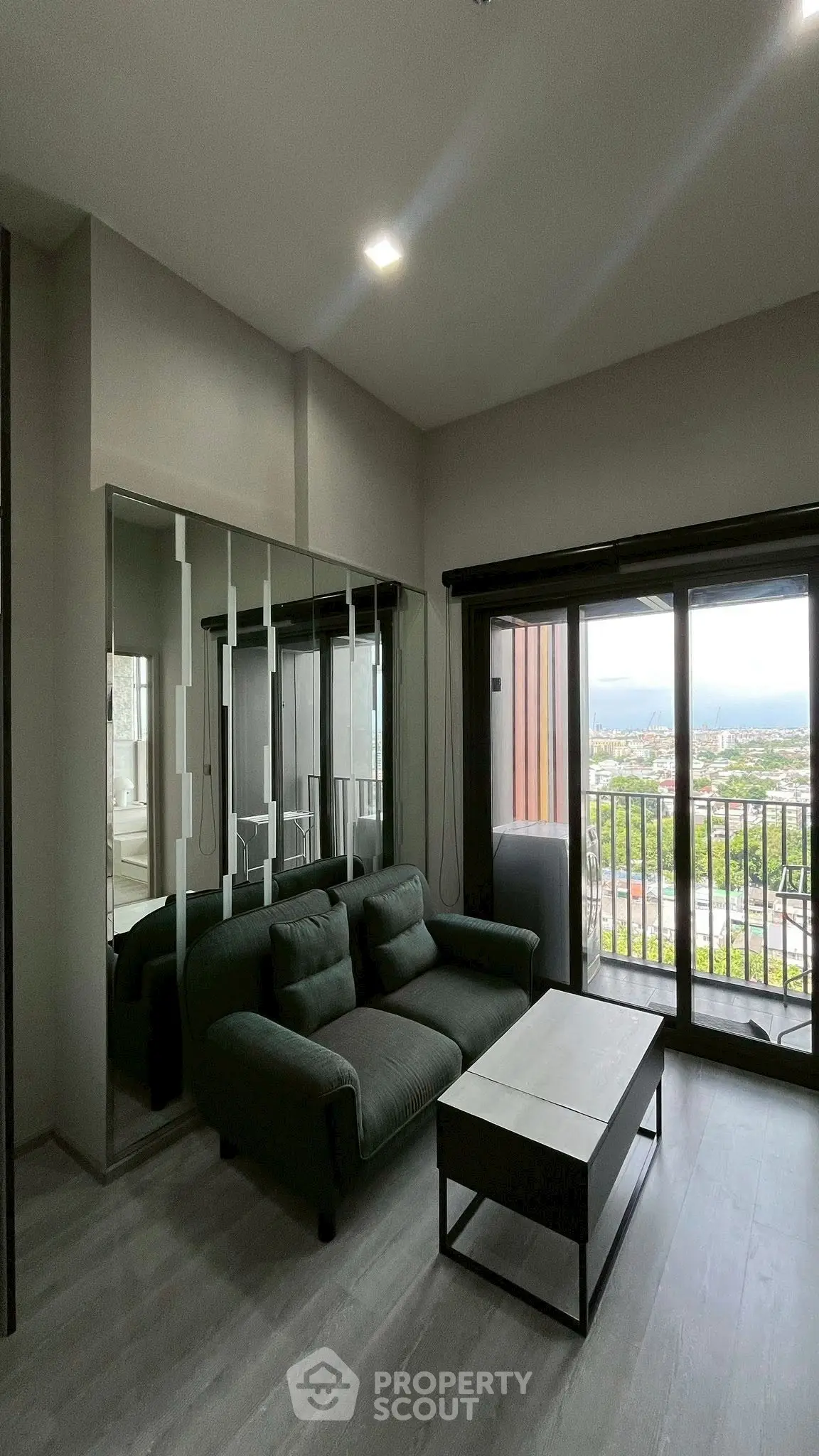Modern living room with large windows and scenic view