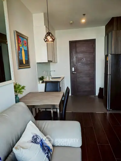 Modern apartment interior with cozy living area and compact kitchen